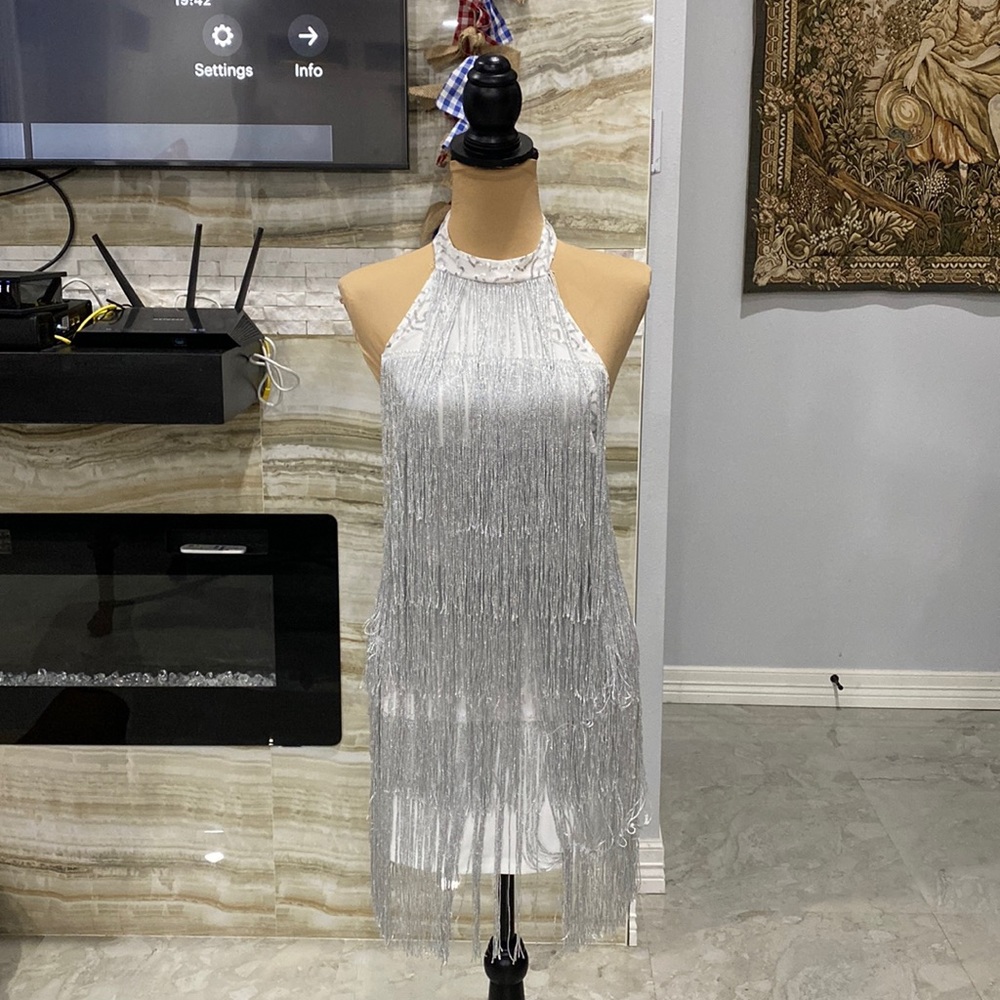 White mini dress with silver fringe. Halter style.